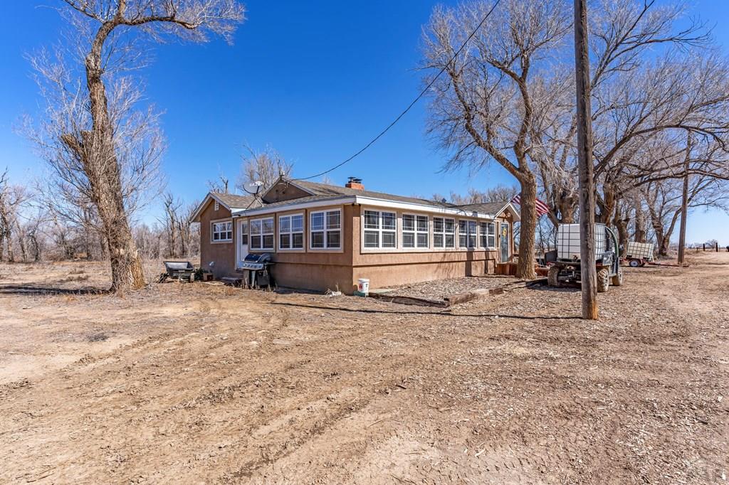 6597 County Lane 14 Ordway, CO 81063 - Photo 25 of 66 a view of a house with a yard covered in snow