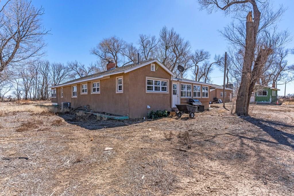 6597 County Lane 14 Ordway, CO 81063 - Photo 26 of 66 a view of a house with a yard covered in snow
