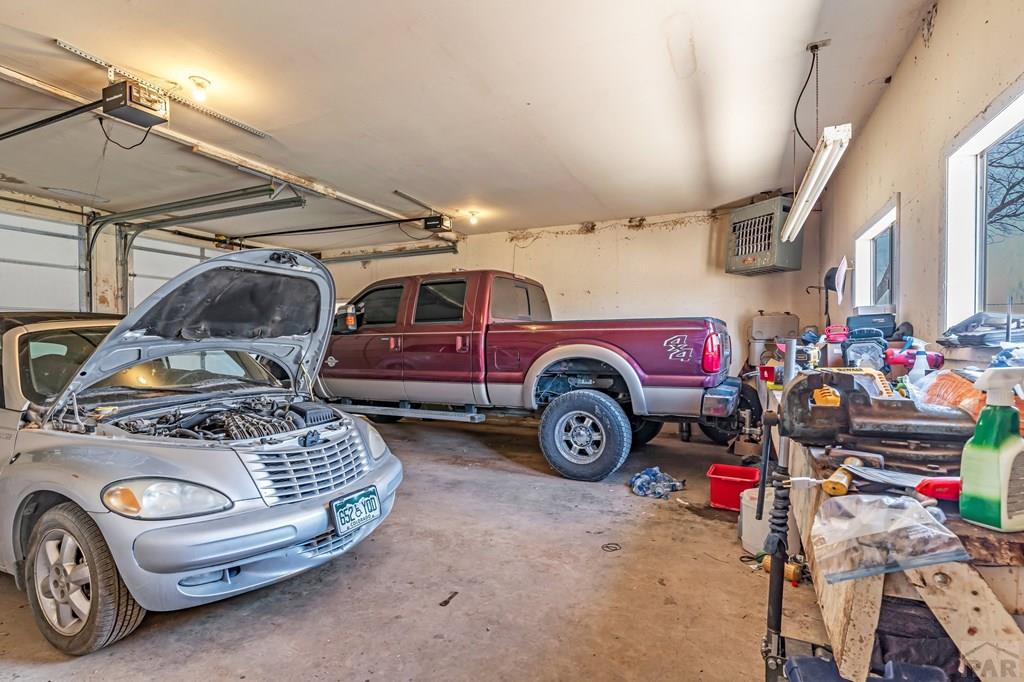 6597 County Lane 14 Ordway, CO 81063 - Photo 29 of 66 a car is parked in a garage