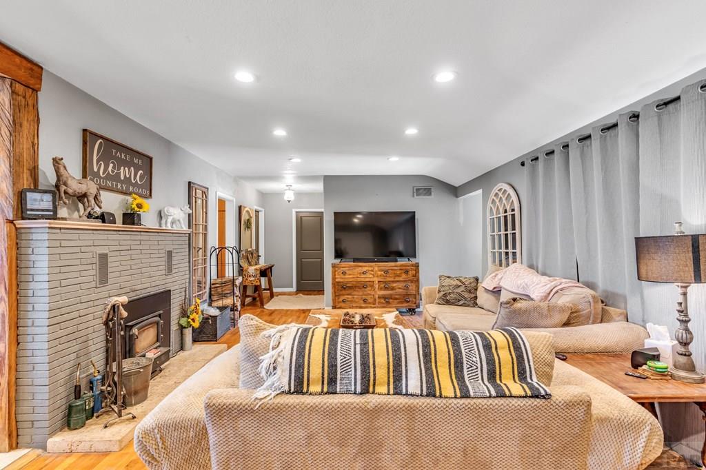 6597 County Lane 14 Ordway, CO 81063 - Photo 6 of 66 a living room with furniture fireplace and a flat screen tv