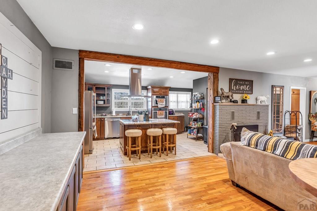 6597 County Lane 14 Ordway, CO 81063 - Photo 8 of 66 a living room with furniture a large window and a dining table