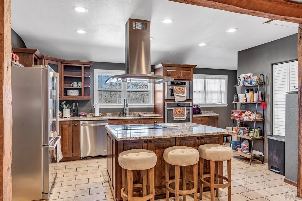 6597 County Lane 14 Ordway, CO 81063 - Photo 10 of 66 a kitchen with stainless steel appliances granite countertop a sink and a refrigerator