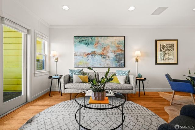 a balcony with chairs and a table