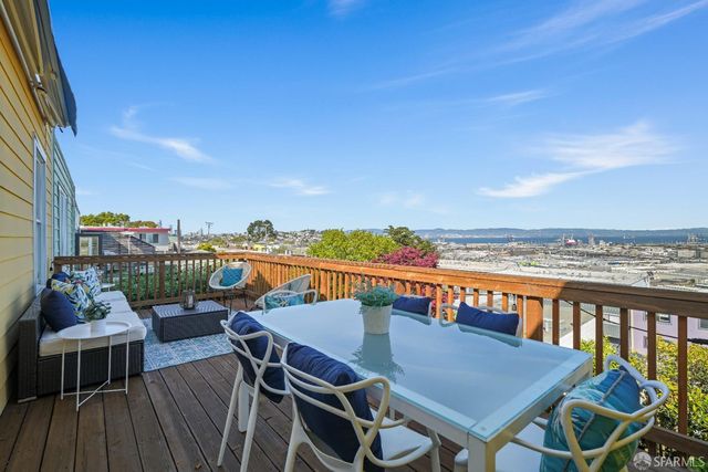 a kitchen with stainless steel appliances a sink stove and cabinets