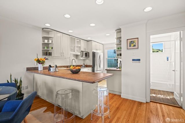 a kitchen with a stove and cabinets