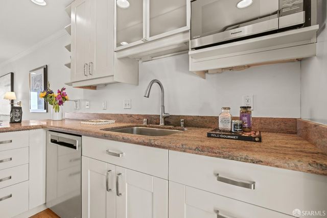 a bedroom with a bed and cupboard