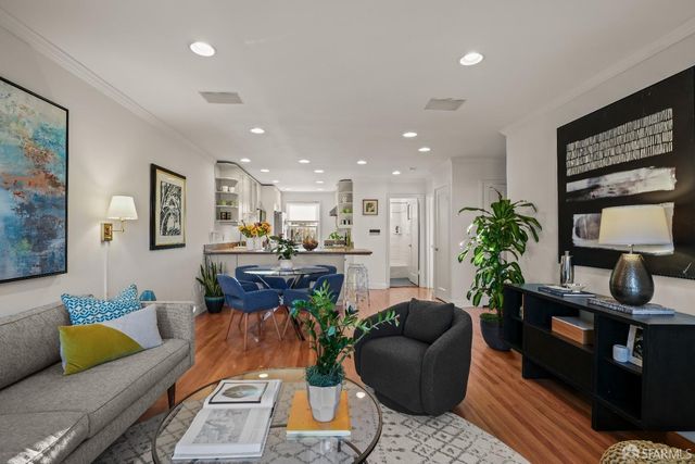 a living room with furniture a rug and a fireplace