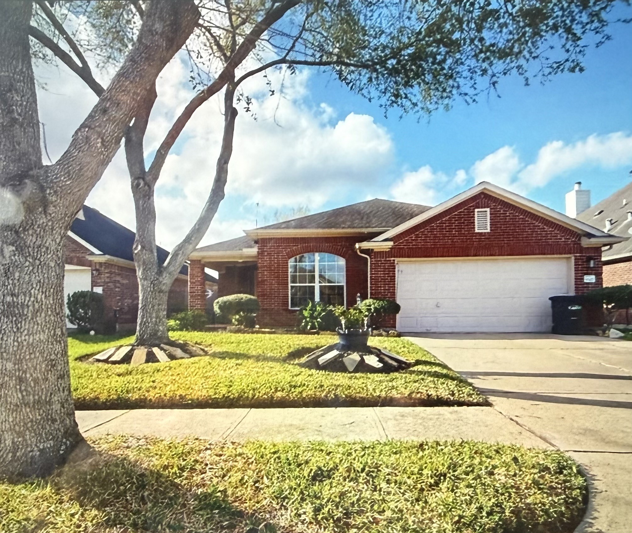9327 Rustler Ridge Ln, One story red brick house, with 3,bedrooms, 2 bathrooms, an office and sitting area/formal dining room and a 2 car garage in Riverstone Ranch.