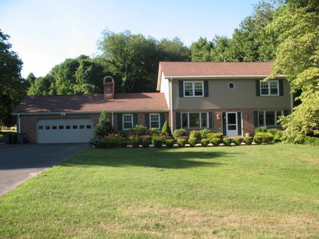 355 Moose Hill Road Monroe, CT 06468 - Photo 1 of 1 a front view of a house with garden and porch