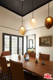 a kitchen with a table and chairs in it