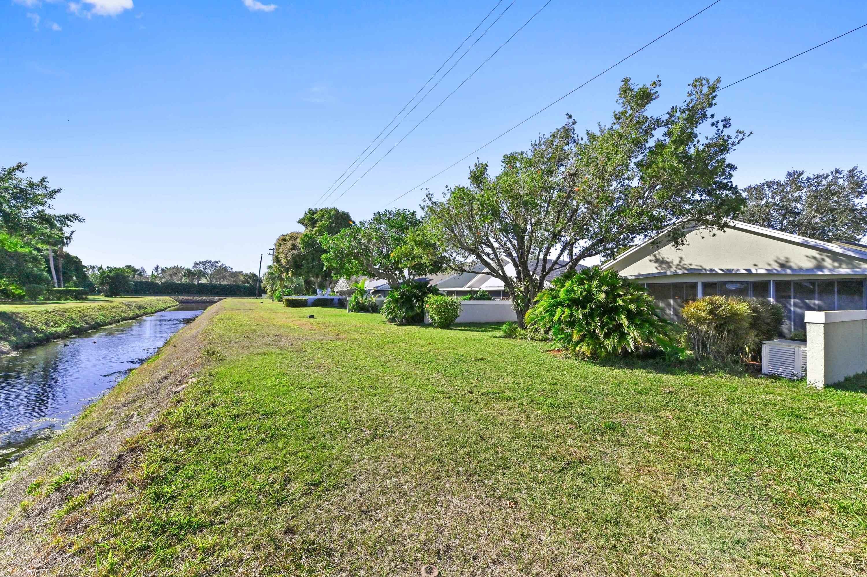 7724 Mansfield Hollow Road Delray Beach, FL 33446 - Photo 33 of 35 Back yard / canal