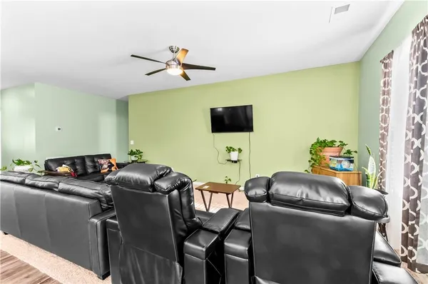 a room with furniture and a flat screen tv