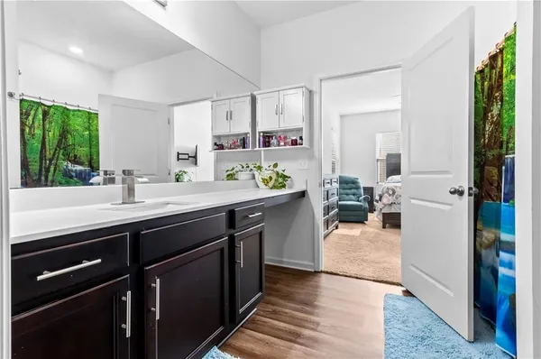 a kitchen with a sink and a stove top oven