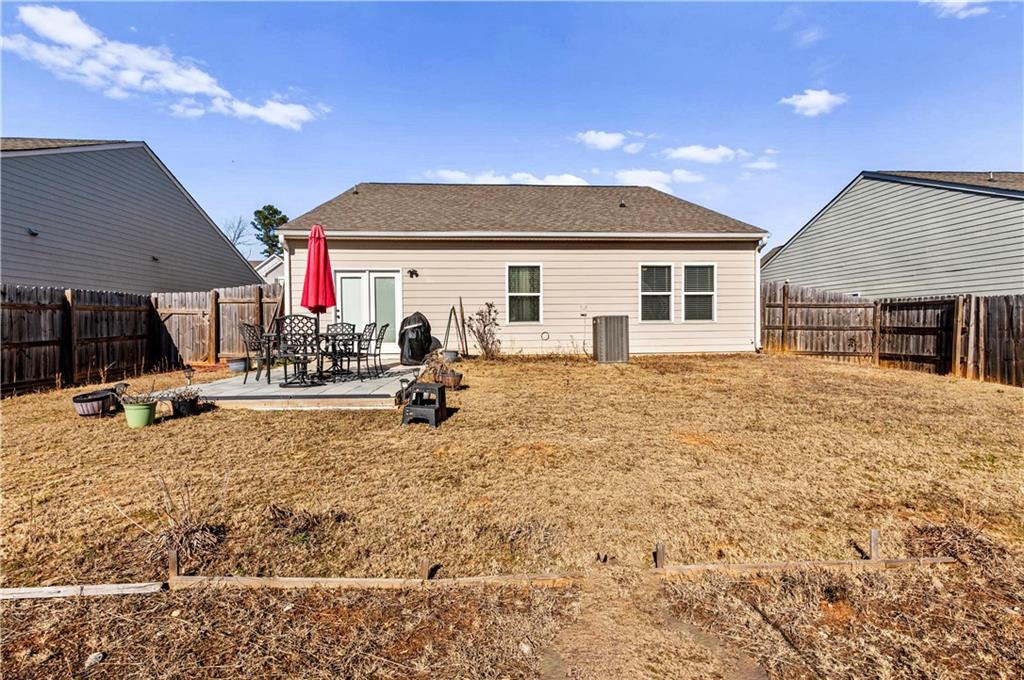 95 Randette Drive Covington, GA 30016 - Photo 26 of 28 a front view of a house with a yard