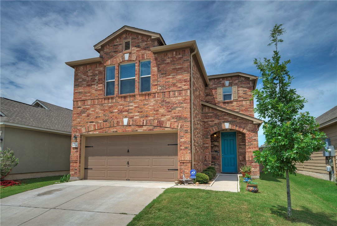6304 Garden Rose Path Austin, TX 78754 - Photo 1 of 1 front view of a house with a yard and an trees