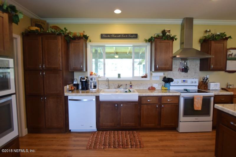 110 Jones Road Crescent City, FL 32112 - Photo 13 of 55 a kitchen with a sink and cabinets