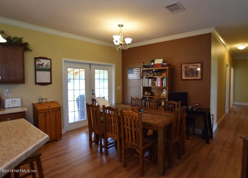110 Jones Road Crescent City, FL 32112 - Photo 16 of 55 a view of a dining room with furniture window and wooden floor