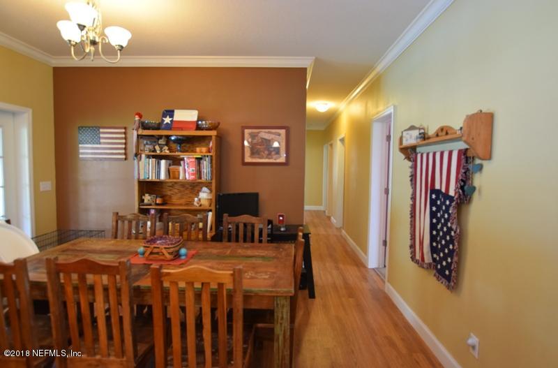110 Jones Road Crescent City, FL 32112 - Photo 17 of 55 a dining room with furniture and wooden floor