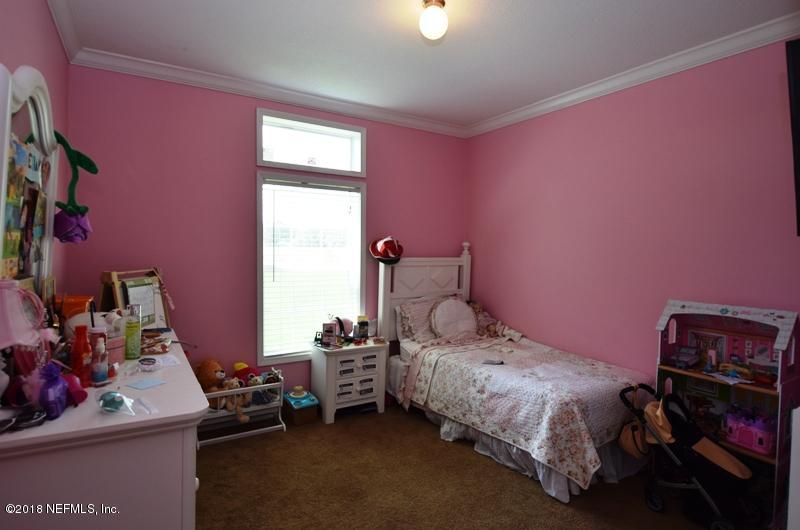 110 Jones Road Crescent City, FL 32112 - Photo 19 of 55 a bedroom with a bed and a window