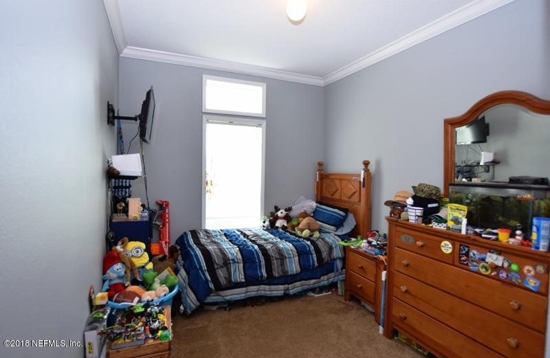 110 Jones Road Crescent City, FL 32112 - Photo 20 of 55 a bed room with a bed and a dresser