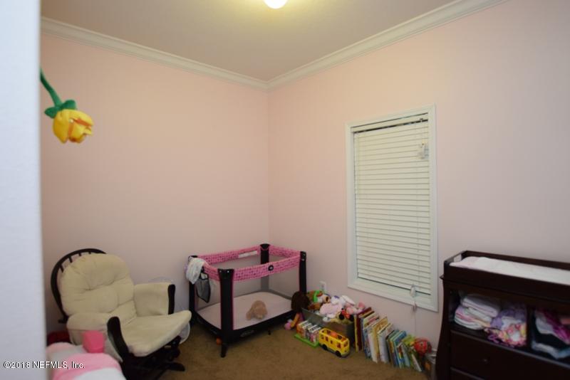 110 Jones Road Crescent City, FL 32112 - Photo 21 of 55 a living room with furniture and a window