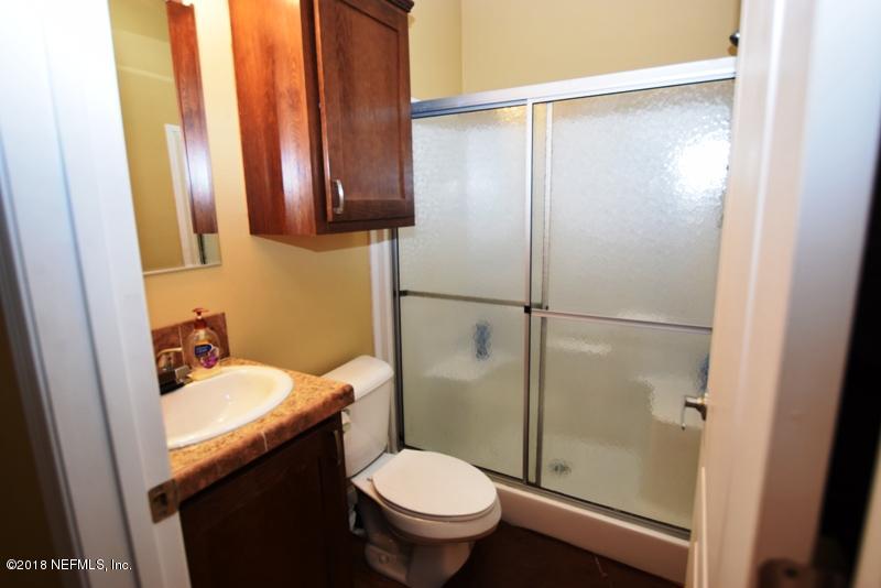 110 Jones Road Crescent City, FL 32112 - Photo 23 of 55 a bathroom with a sink toilet and shower