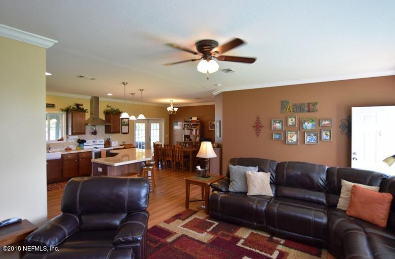 110 Jones Road Crescent City, FL 32112 - Photo 30 of 55 a living room with furniture and a large window