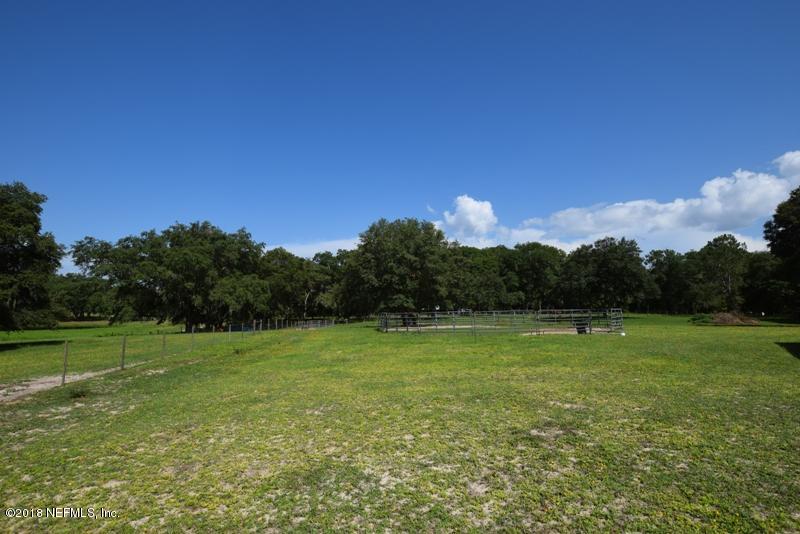 110 Jones Road Crescent City, FL 32112 - Photo 43 of 55 a view of outdoor space with green field and trees