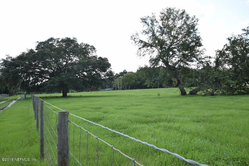 110 Jones Road Crescent City, FL 32112 - Photo 55 of 55 a view of a green field with wooden fence