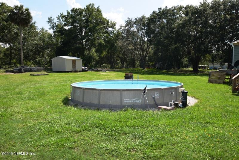 110 Jones Road Crescent City, FL 32112 - Photo 6 of 55 a swimming pool with outdoor and trees