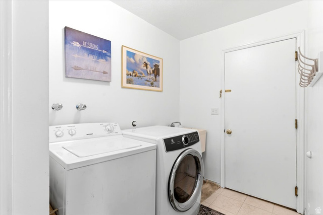 5321 South 3100th Street West Roy, UT 84067 - Photo 54 of 64 Dedicated laundry area featuring a white top-load washing machine and a front-load dryer