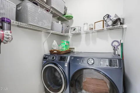 a utility room with furniture a washer and dryer