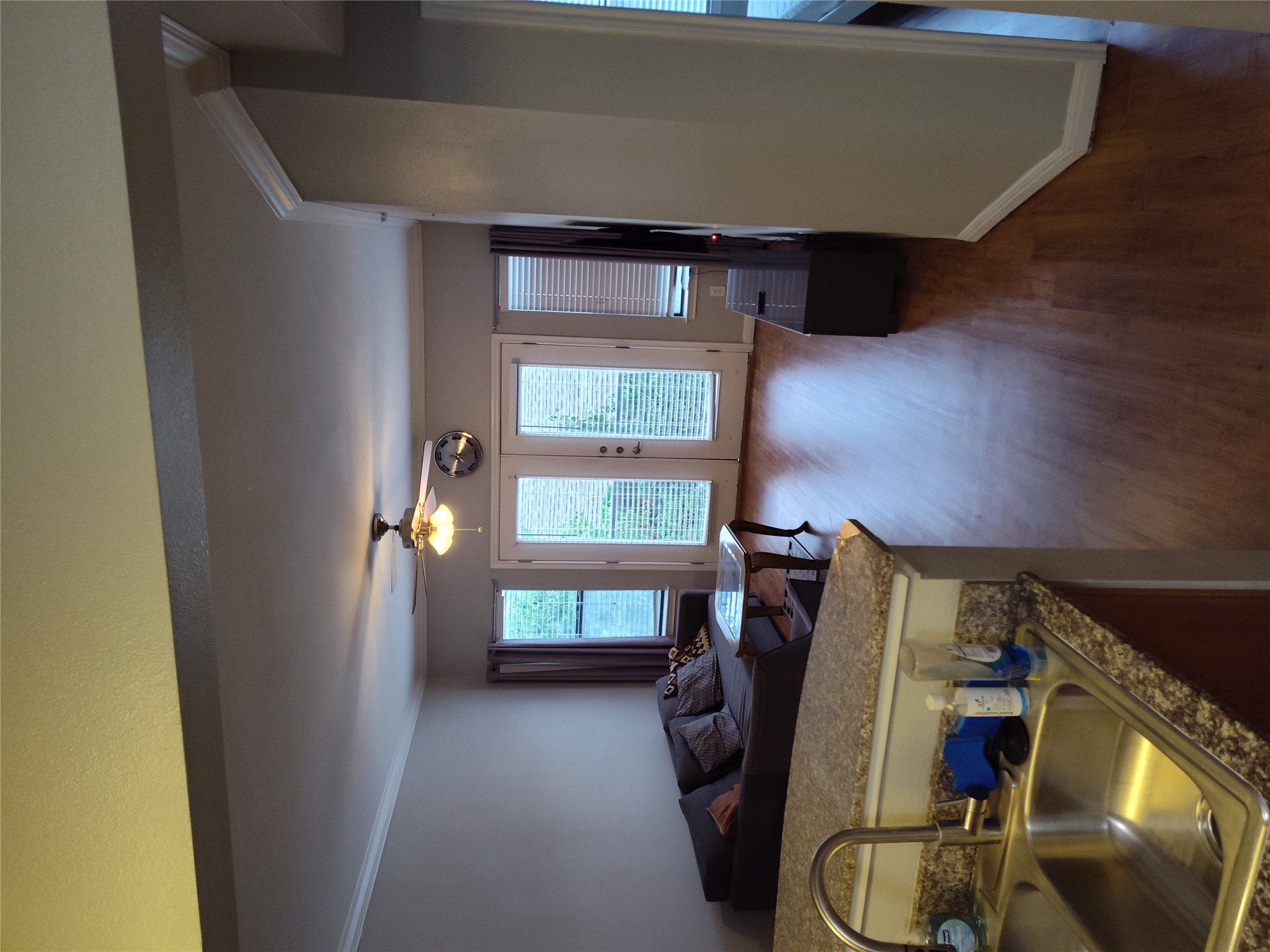 2502 Leon Street, Unit 304 Austin, TX 78705 - Photo 10 of 10 a living room with furniture and a wooden floor