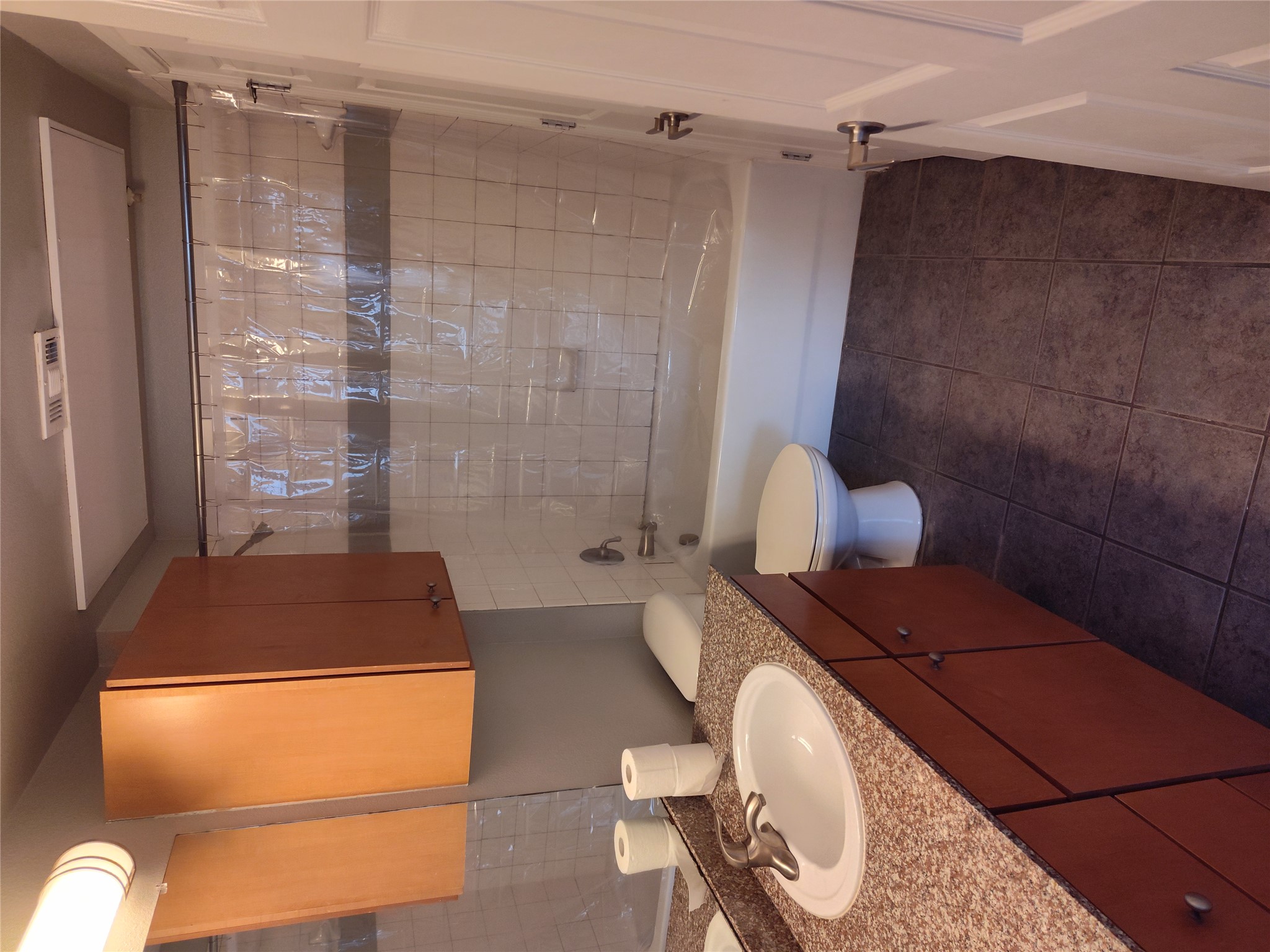 2502 Leon Street, Unit 304 Austin, TX 78705 - Photo 6 of 10 a bathroom with a granite countertop sink toilet and shower