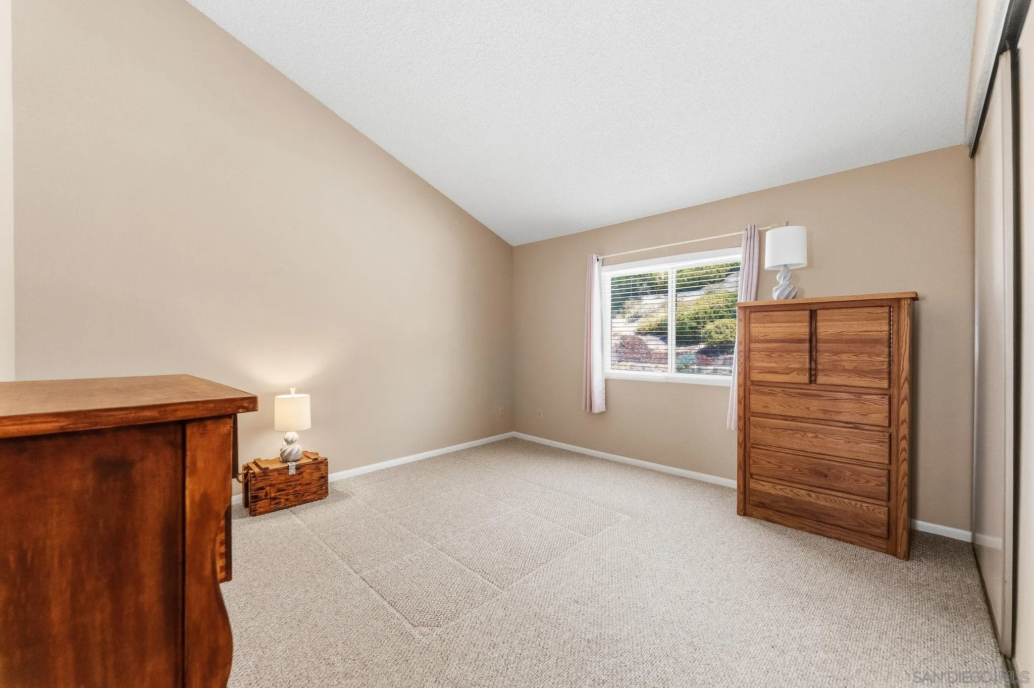 10565 Strathmore Drive Santee, CA 92071 - Photo 29 of 59 an empty room with furniture and window