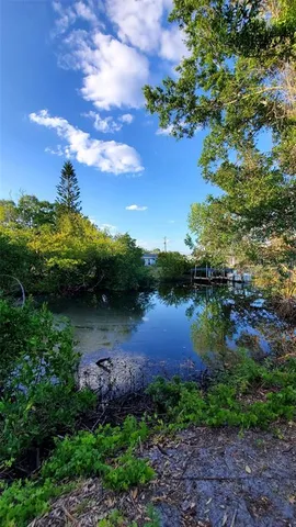 a view of lake with green space