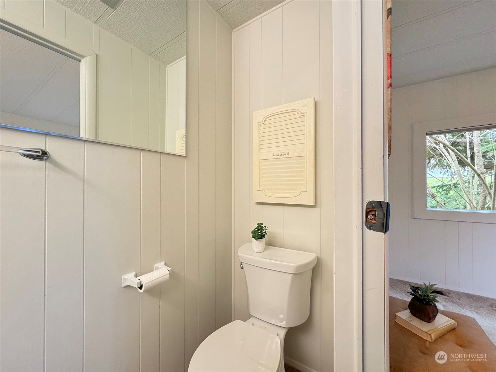 241 Evans Road Sequim, WA 98382 - Photo 19 of 40 a white toilet sitting next to a bathroom sink