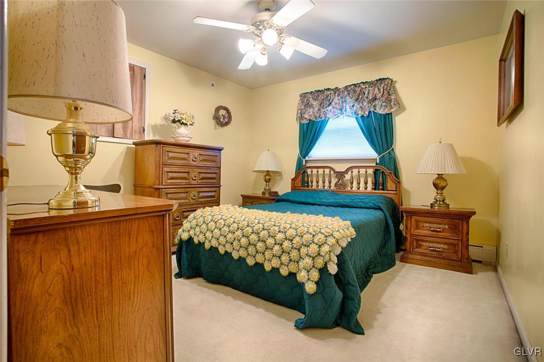 349 Meyer Road Nazareth, PA 18064 - Photo 20 of 38 a bedroom with a bed and dresser with mirror