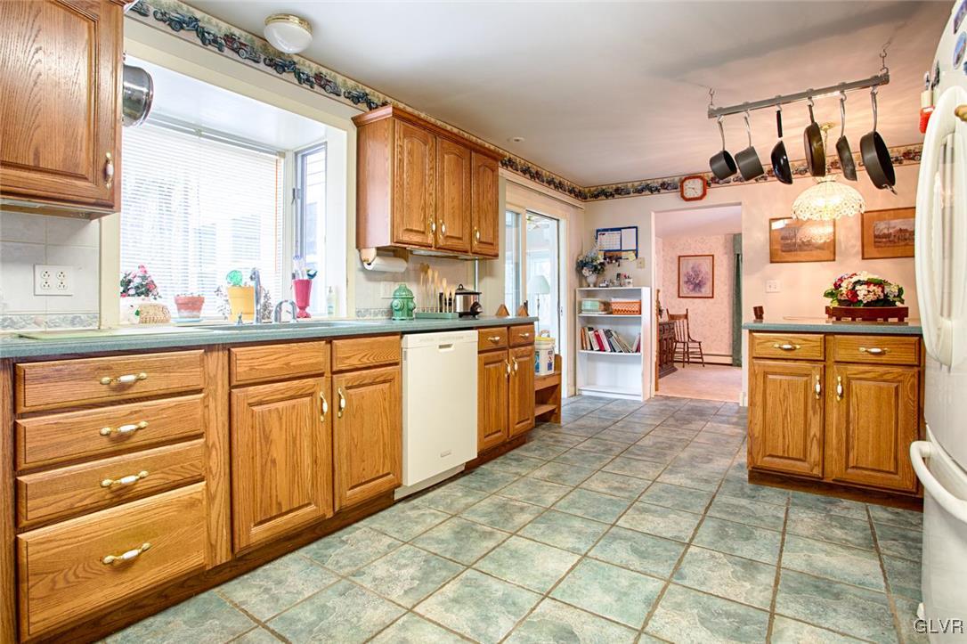 349 Meyer Road Nazareth, PA 18064 - Photo 3 of 38 a kitchen with stainless steel appliances a sink and cabinets