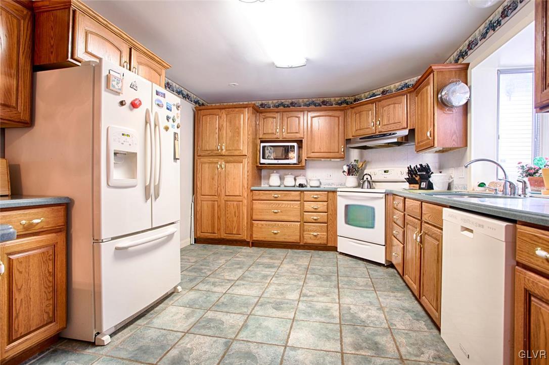 349 Meyer Road Nazareth, PA 18064 - Photo 5 of 38 a kitchen with stainless steel appliances a refrigerator sink and cabinets