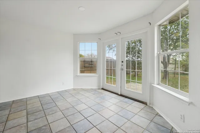 a view of an empty room and window