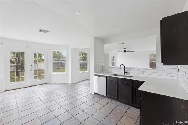 a spacious bathroom with a double vanity sink mirror and