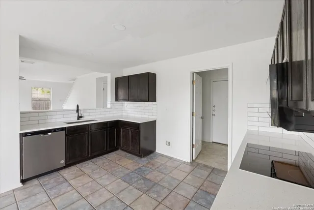 a spacious bathroom with a sink and a mirror