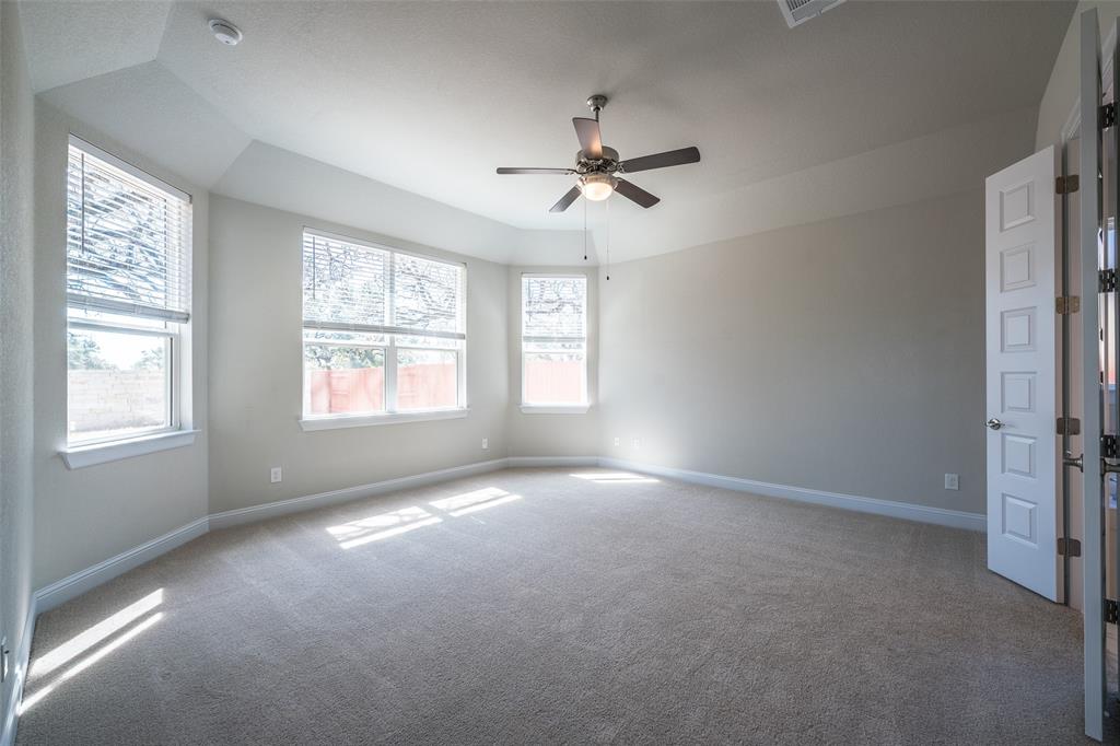 113 Old Trinity Way Georgetown, TX 78628 - Photo 11 of 27 Carpeted spare room featuring ceiling fan and baseboards