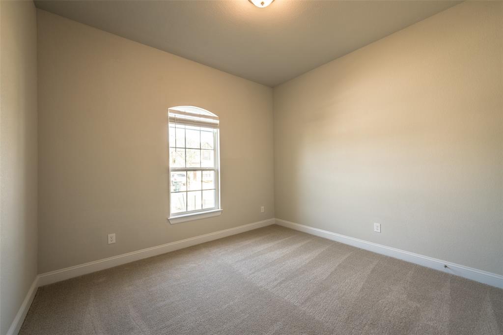 113 Old Trinity Way Georgetown, TX 78628 - Photo 16 of 27 Unfurnished room with light carpet and baseboards