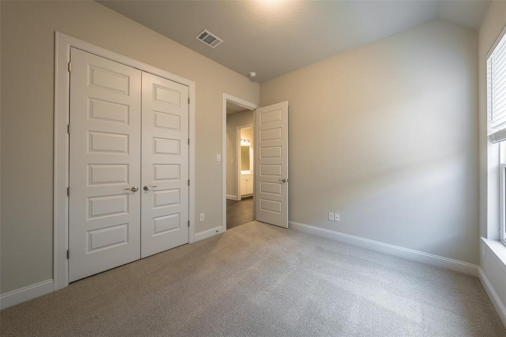 113 Old Trinity Way Georgetown, TX 78628 - Photo 22 of 27 Unfurnished bedroom featuring light colored carpet and a closet