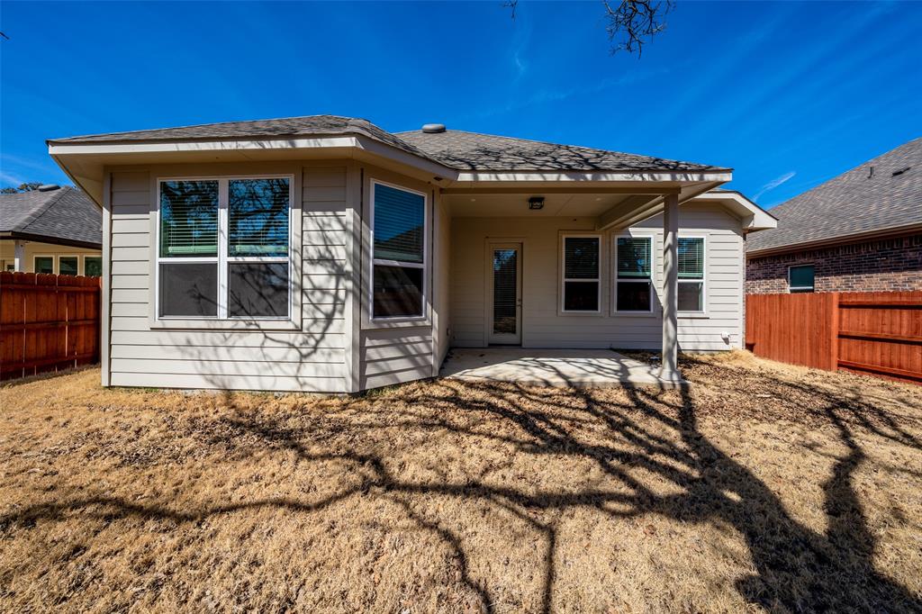 113 Old Trinity Way Georgetown, TX 78628 - Photo 26 of 27 Back of house with a fenced backyard and a patio area