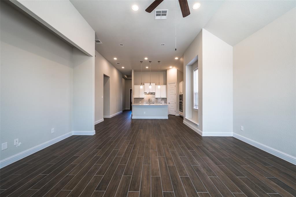 113 Old Trinity Way Georgetown, TX 78628 - Photo 6 of 27 Unfurnished living room with recessed lighting, ceiling fan, and wood tiled floors