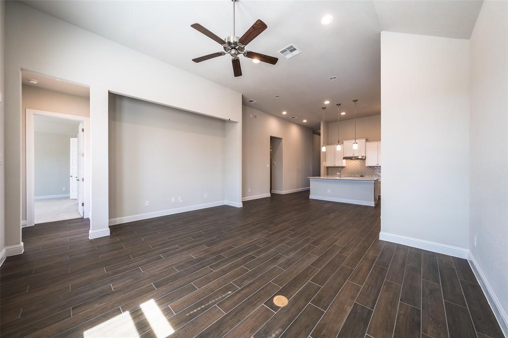113 Old Trinity Way Georgetown, TX 78628 - Photo 8 of 27 Unfurnished living room featuring a ceiling fan, wood finish floors, and recessed lighting
