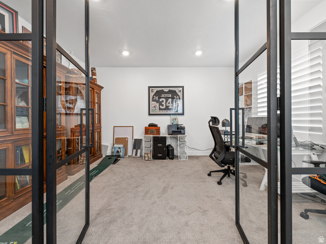 627 South Meade Street Mapleton, UT 84664 - Photo 12 of 48 Room featuring black-framed glass double doors, recessed ceiling lighting, and light-toned carpet flooring